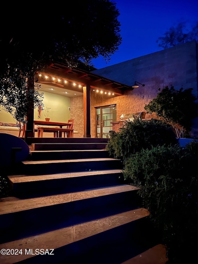 exterior entry at twilight with french doors