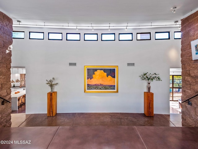 community lobby featuring a towering ceiling