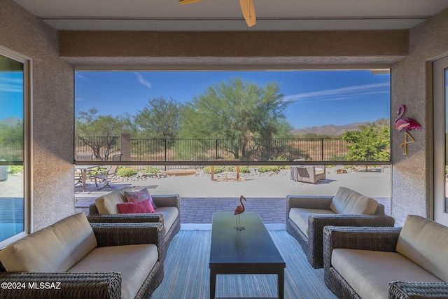 view of patio / terrace with an outdoor living space and ceiling fan