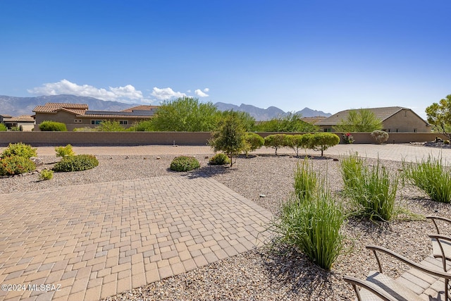 exterior space featuring a mountain view and a patio