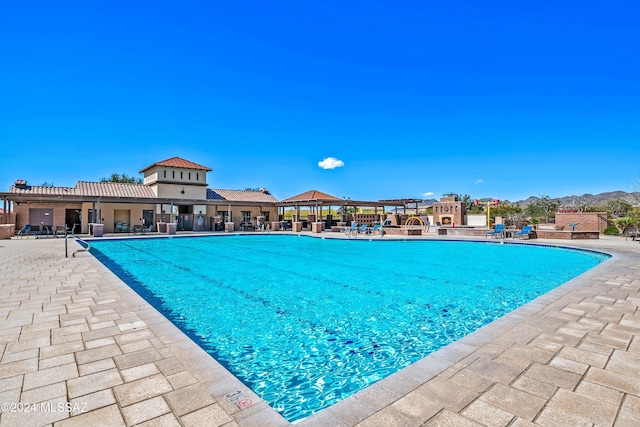 view of swimming pool with a patio area