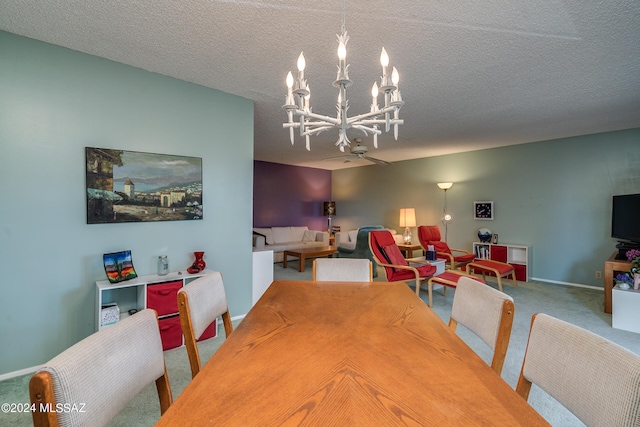 carpeted dining room with a textured ceiling and an inviting chandelier