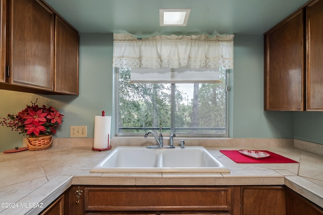 kitchen featuring sink and tile counters