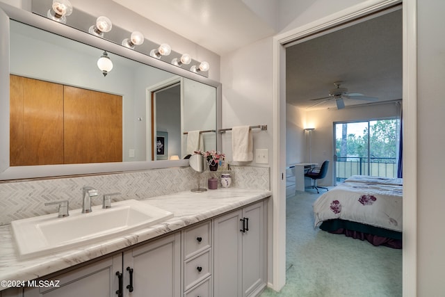 bathroom with vanity, backsplash, and ceiling fan