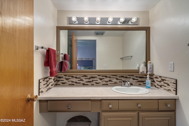 bathroom with vanity and backsplash