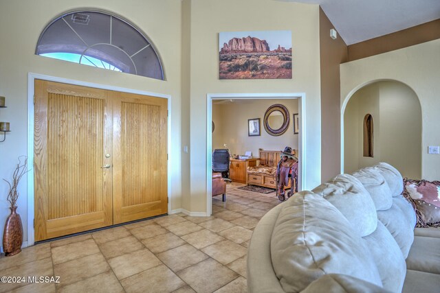 foyer entrance with high vaulted ceiling