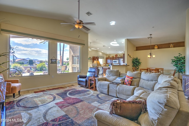 living room with vaulted ceiling and ceiling fan