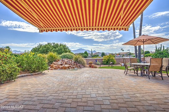 view of patio / terrace with a mountain view