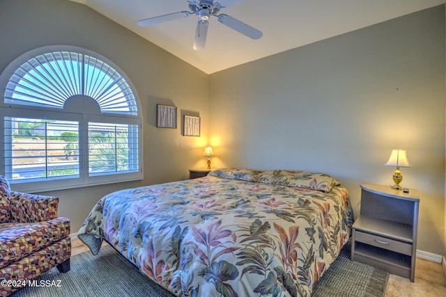 bedroom featuring vaulted ceiling, ceiling fan, and carpet floors