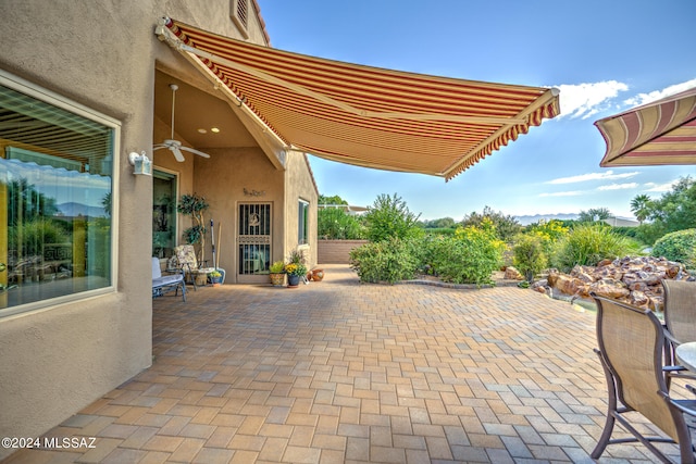 view of patio featuring ceiling fan