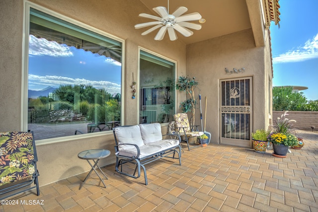 view of patio featuring ceiling fan