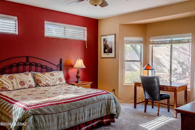 carpeted bedroom featuring ceiling fan