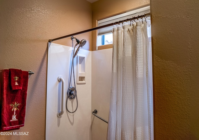 bathroom featuring a shower with curtain