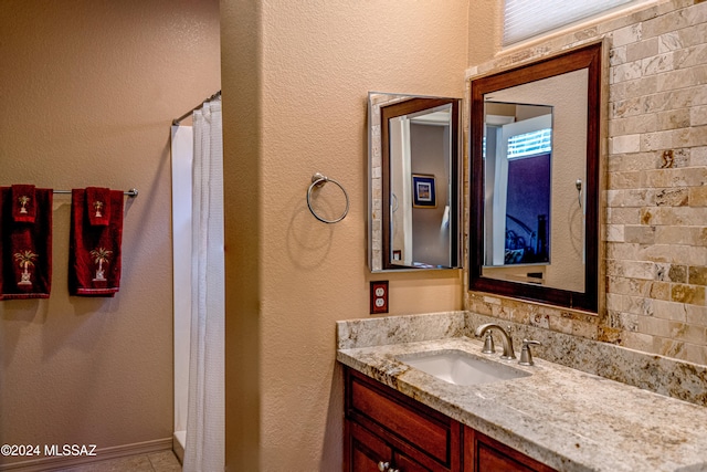 bathroom with a shower with curtain and vanity