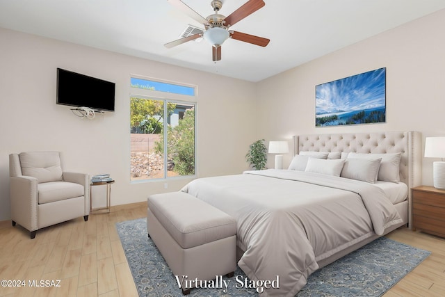 bedroom with ceiling fan and light wood-type flooring