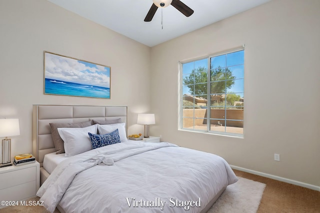 bedroom featuring ceiling fan and carpet floors