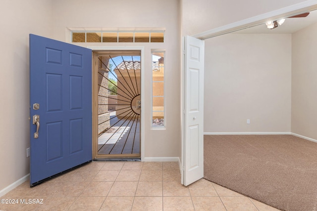 view of carpeted foyer