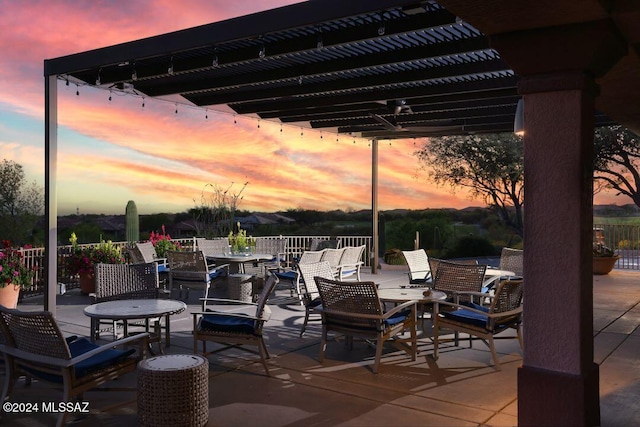 patio terrace at dusk with a pergola