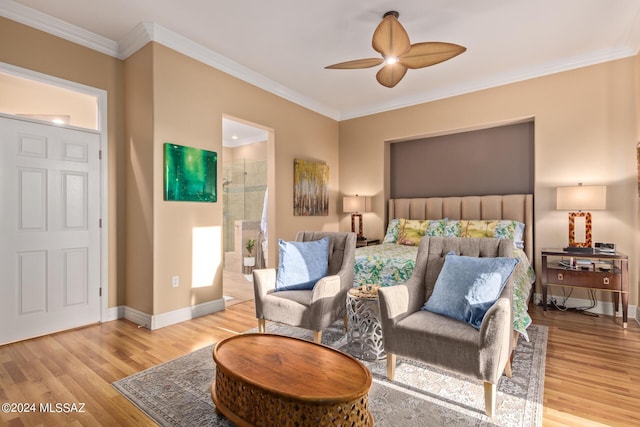 bedroom featuring baseboards, ornamental molding, and wood finished floors