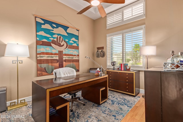 office space featuring ceiling fan and light wood-type flooring