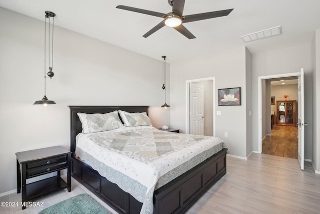 bedroom featuring light hardwood / wood-style floors and ceiling fan