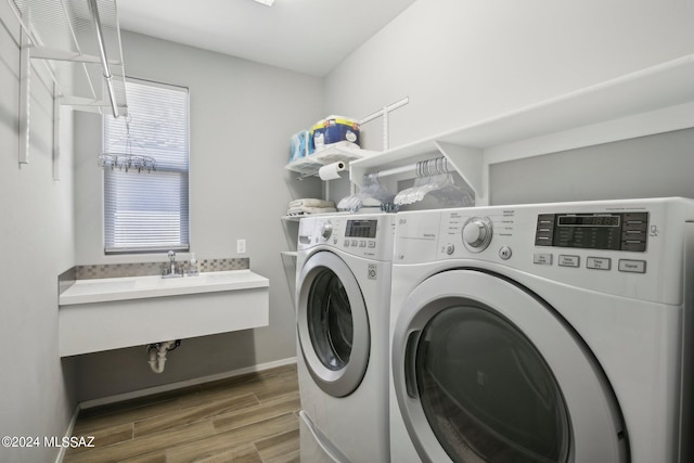 laundry area with dark wood-type flooring and washer and clothes dryer