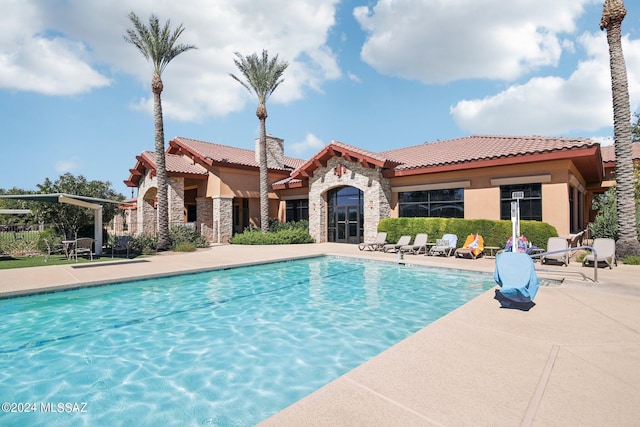 view of pool featuring a patio