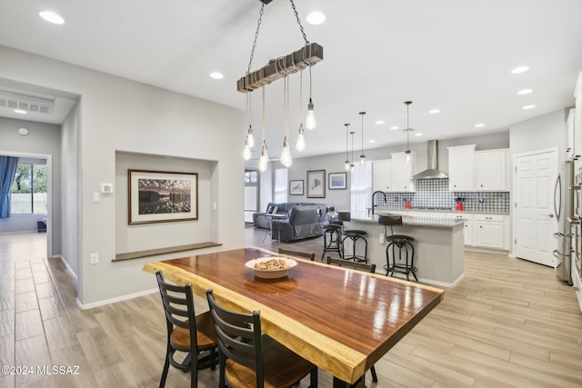 dining room featuring light wood-type flooring