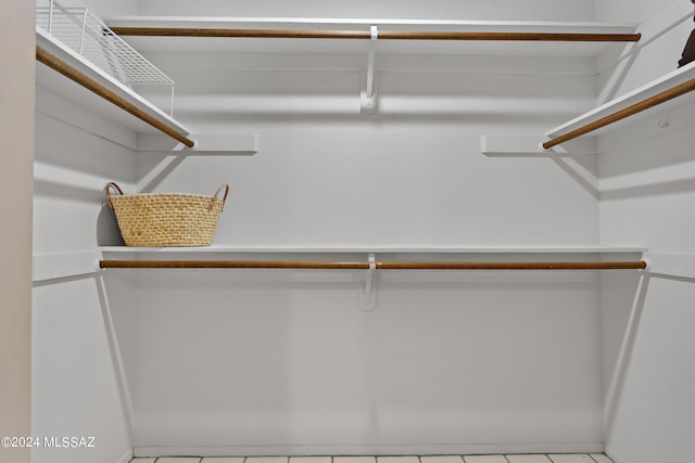 walk in closet featuring light tile patterned floors