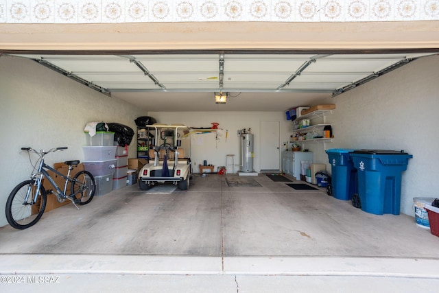 garage featuring a garage door opener and water heater