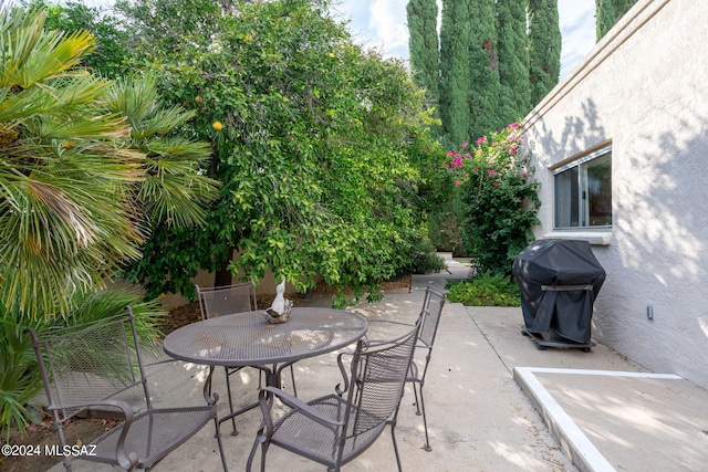 view of patio featuring a grill