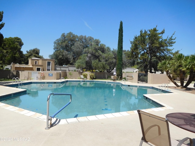 view of pool featuring a patio