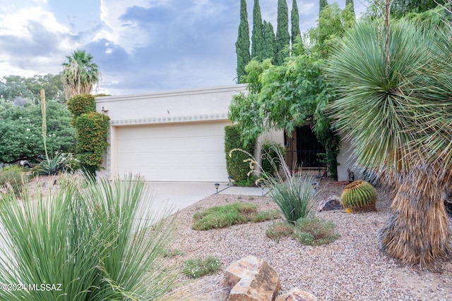 view of front of property with a garage