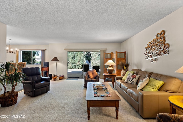 carpeted living room with a chandelier and a textured ceiling