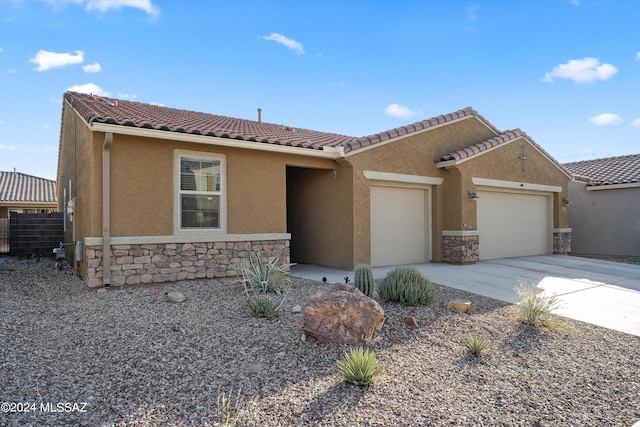 single story home featuring a garage