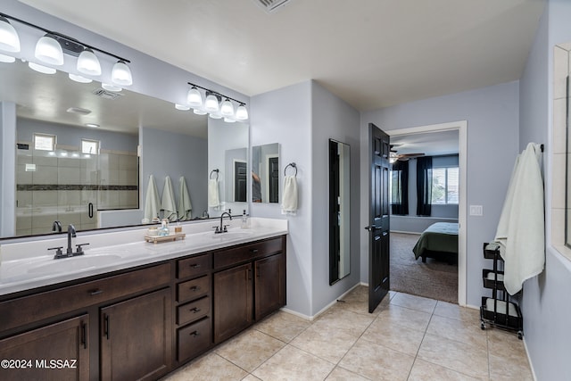 bathroom with vanity, ceiling fan, tile patterned floors, and tiled shower