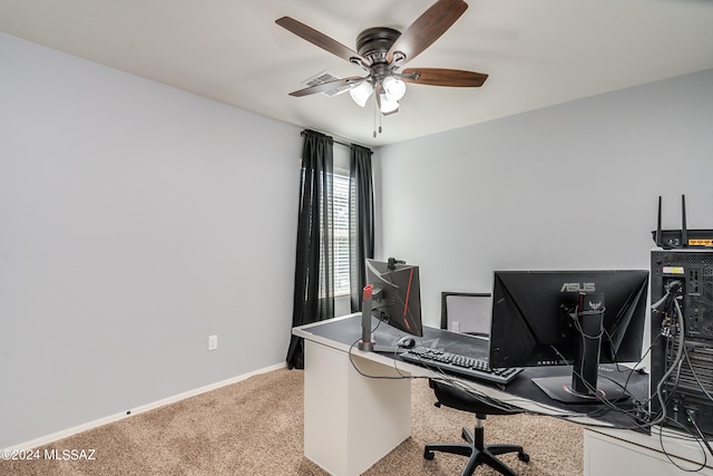 home office with carpet floors and ceiling fan