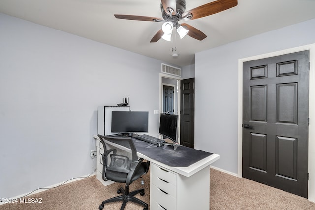 home office with carpet flooring and ceiling fan