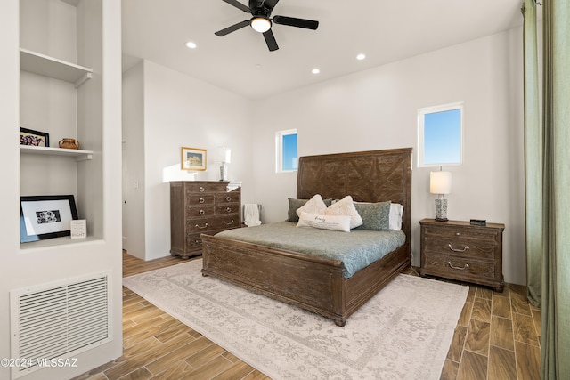 bedroom featuring ceiling fan and hardwood / wood-style flooring