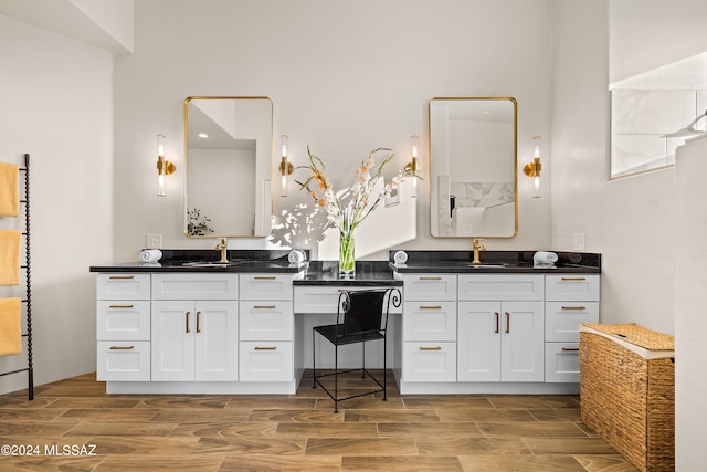 bathroom featuring wood-type flooring and vanity