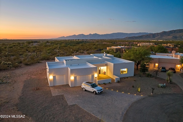13123 E Molokai Ln, Vail, AZ 85641 - view of front of home with an attached garage, driveway, a mountain view, and stucco siding