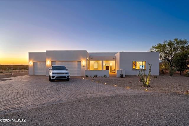 13123 E Molokai Ln, Vail, AZ 85641 - view of front of home featuring an attached garage, decorative driveway, and stucco siding