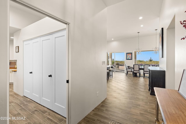 13123 E Molokai Ln, Vail, AZ 85641 - hallway featuring an inviting chandelier, recessed lighting, a high ceiling, and wood finished floors