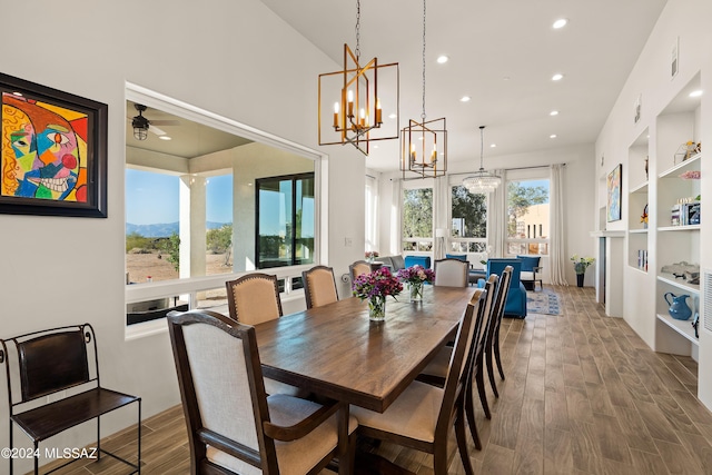 13123 E Molokai Ln, Vail, AZ 85641 - dining space with recessed lighting, built in shelves, wood finished floors, and ceiling fan with notable chandelier