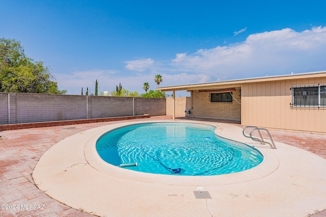 view of swimming pool with a patio area