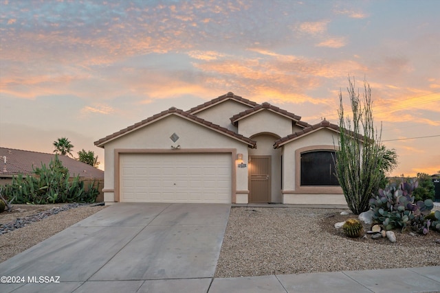 view of front of home with a garage