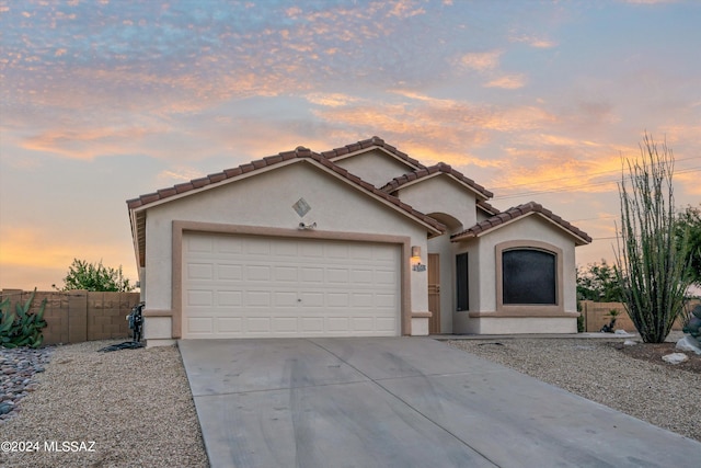 view of front of property with a garage