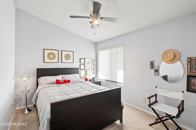 carpeted bedroom with ceiling fan and lofted ceiling