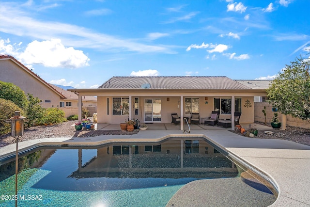 view of swimming pool with a patio area