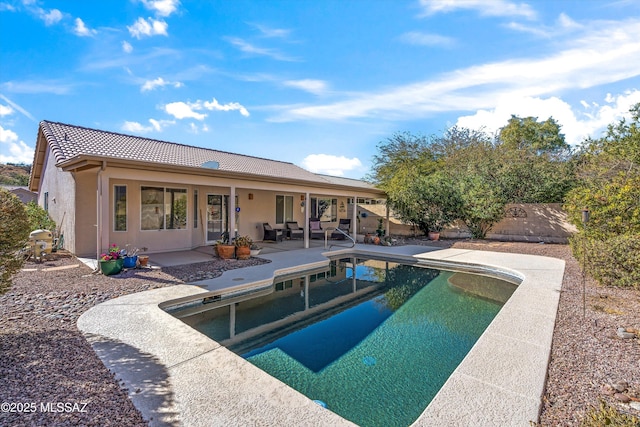 view of swimming pool featuring a patio